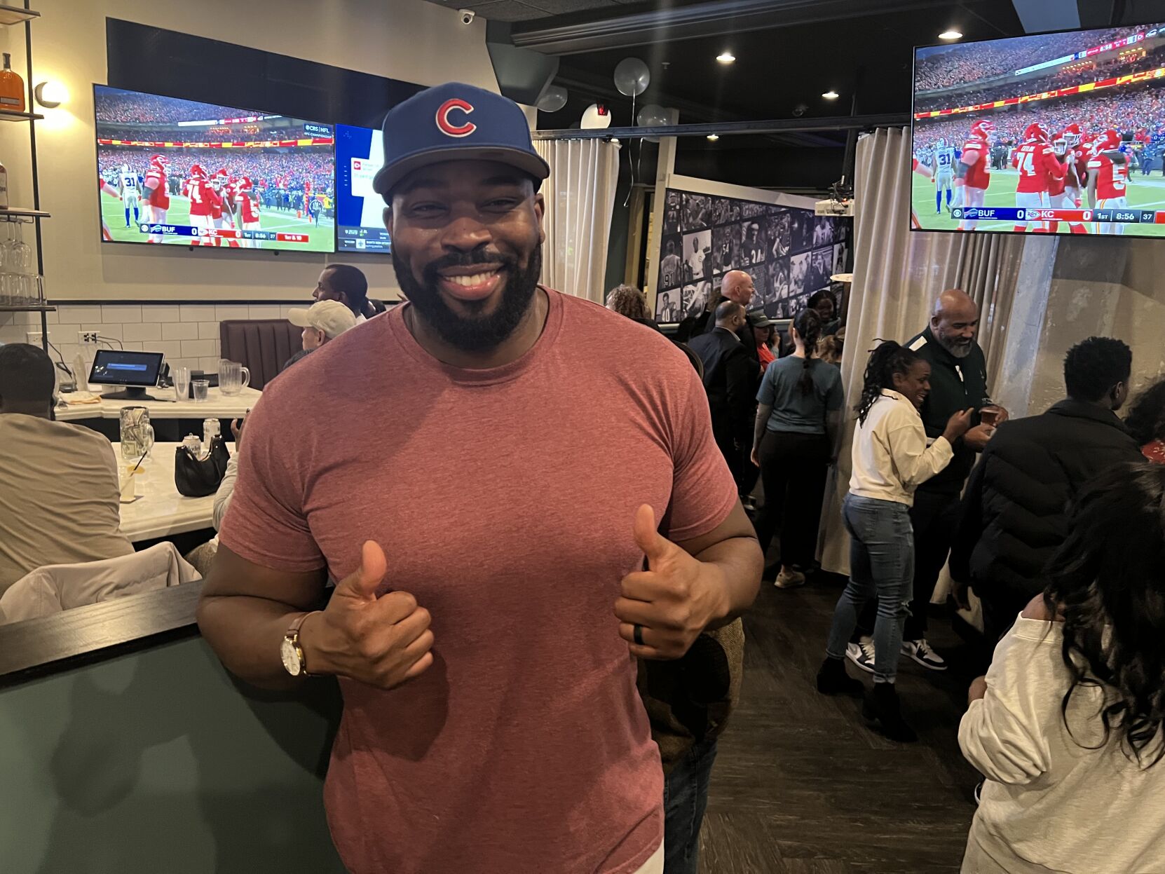 Israel Idonije is all smiles at the opening of his latest bar/restaurant, The Staley. (Photo by Candace Jordan)